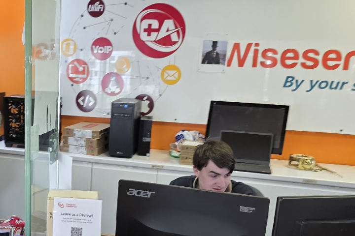 Our technician providing IT support to a client in Oxford office